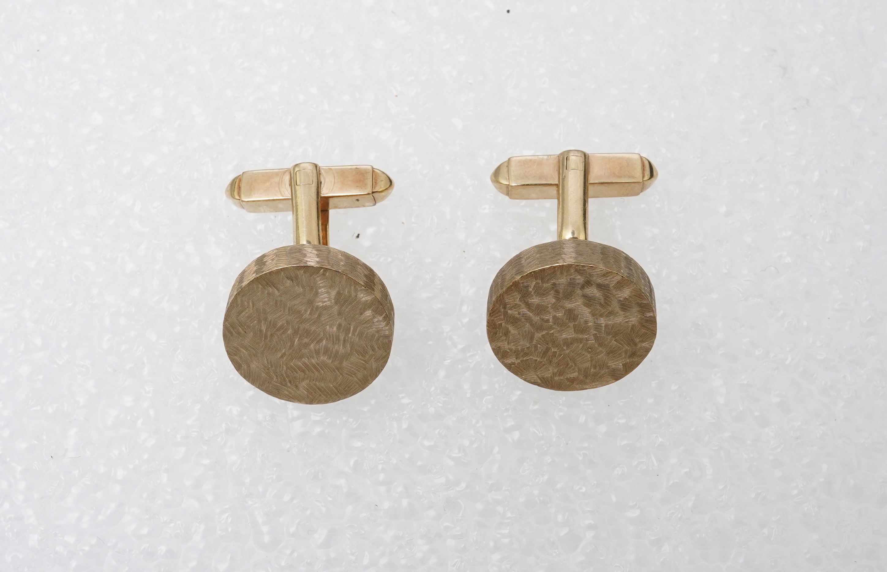 A pair of gold cufflinks, circa 1964